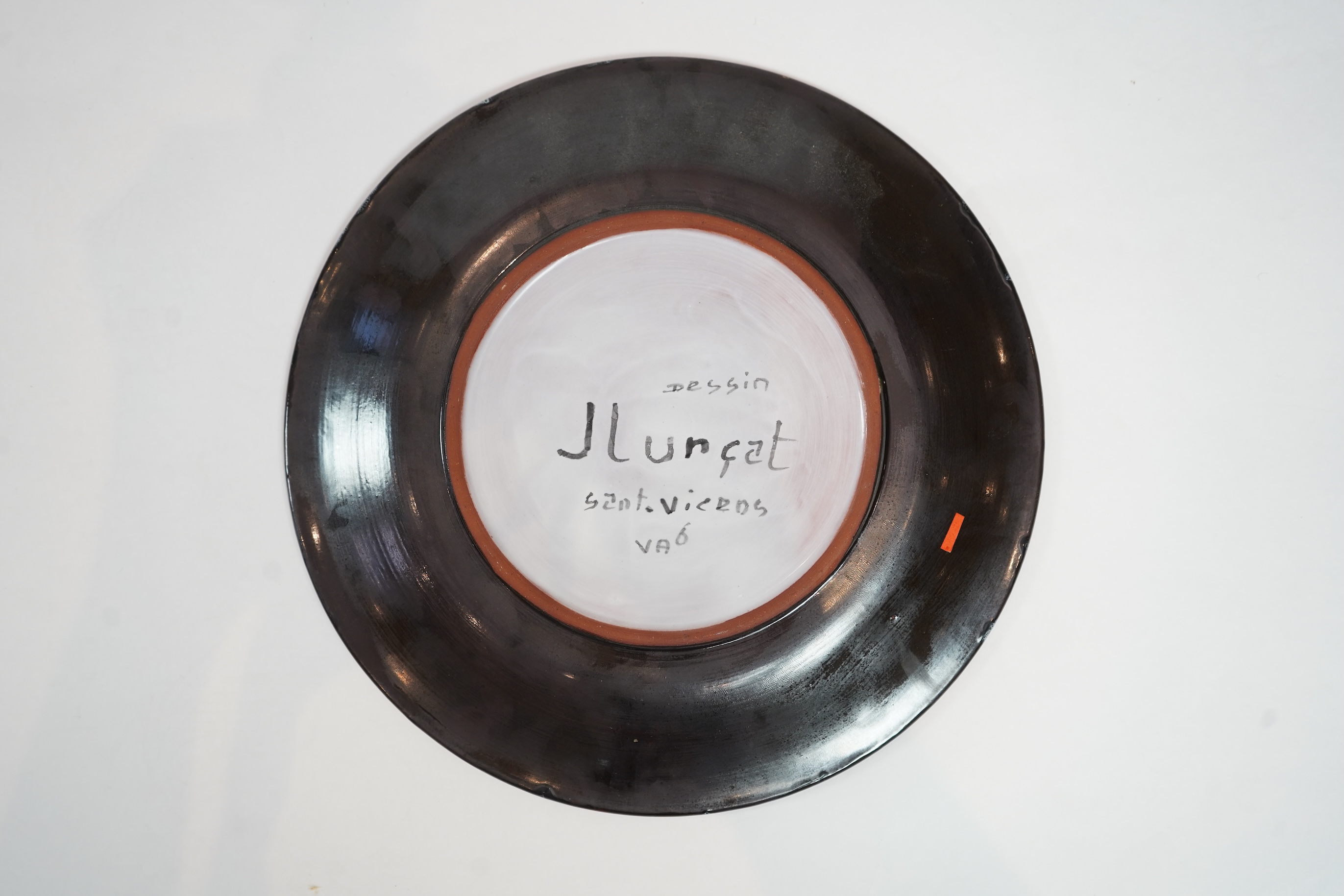 Jean Lurçat (1892-1966): An ochre glazed earthenware plate, decorated with a stylised central figure